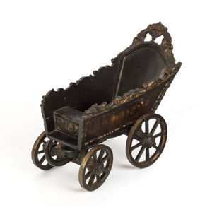 A Dutch folk art carved wood and iron toy cart, beautifully…