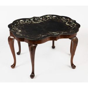 A Victorian papier mache tray on a later walnut stand, circa…