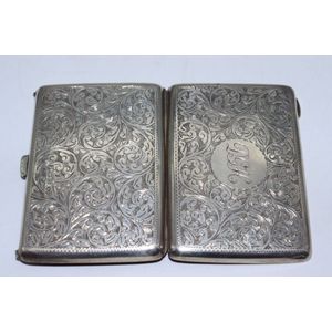 Edwardian sterling silver card case, heavily embossed scroll…