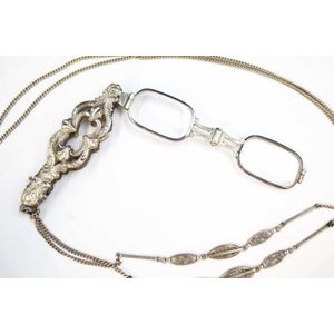 Ornate pendant type German silver lorgnette on a silver chain.…