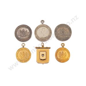 Family group of five Southland Agricultural gold and silver…