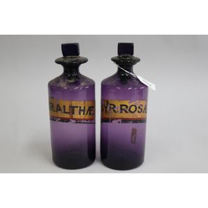Pair of Amethyst glass chemist bottles, SYR:ROSAE and SYR:…