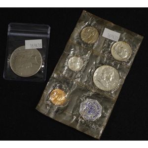 Six American coins including a 1925 one dollar silver coin, a…