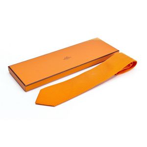 A silk tie by Hermes, styled with orange dots on an orange&hellip;