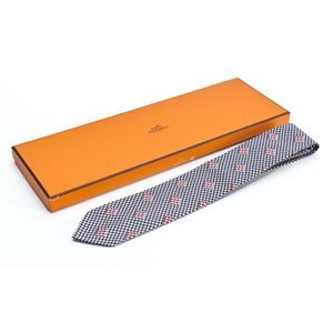 A silk tie by Hermes, styled with a houndstooth and red check&hellip;