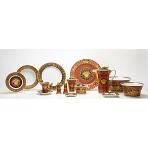 A forty eight piece porcelain dinner set by Versace, from the…
