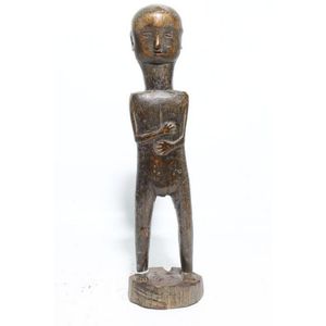 A Dyak female ancestral figure, hands clasped to torso, dark&hellip;