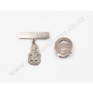 Two New Zealand sterling silver club badges one with a tiki…