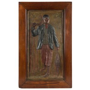 An Australian painted chalk ware plaque of an Aborigine in red…