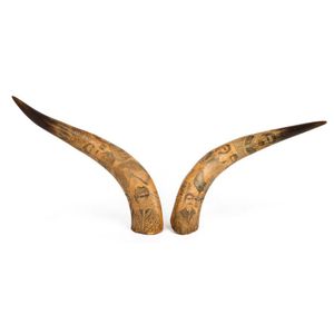 A pair of antique scrimshaw cow horns, 19th century. With…