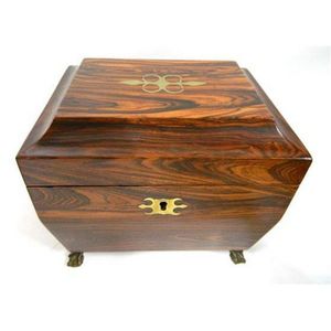 A Victorian rosewood tea caddy, with brass inlay & claw feet