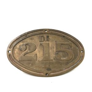 A vintage bronze diesel locomotive registration plate Ds215.…