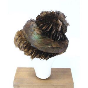 A fine duck feather hat, after Caroline 