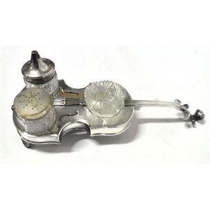 A silver plate Cello shaped cruet set including a pepper, salt…