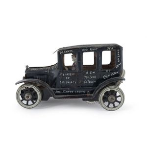 Graffiti-covered honey Mooners four-door tinplate wind-up…