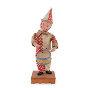 Wind-up drummer boy dressed as a clown with original outfit,…