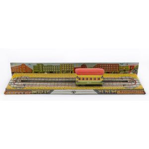Tin-plate lithographed wind-up trolley car on track with…