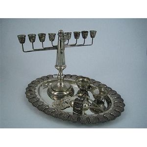 Six Judaica silver pieces, including a Menora, a dradle and an…