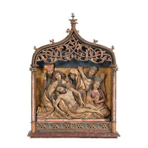 A large carved and gilded polychrome lamentation, probably…