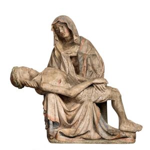 A carved stone polychrome decorated figure group of the Pieta,…
