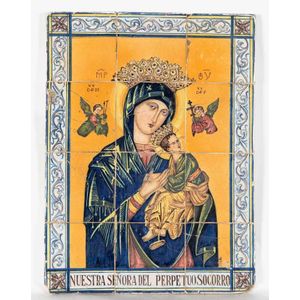 An Italian maiolica tile panel of the Madonna and Child,…