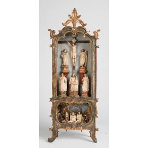 A carved and gilt polychrome retablo, probably Spanish, 18th…