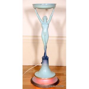 An Art Deco figural metalware smokers stand and light, circa…