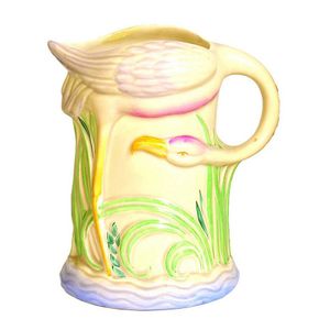 A Clarice Cliff flamingo jug, relief moulded and painted, the…