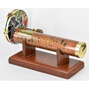 A kaleidoscope, round brass tube, with two rotating circular…