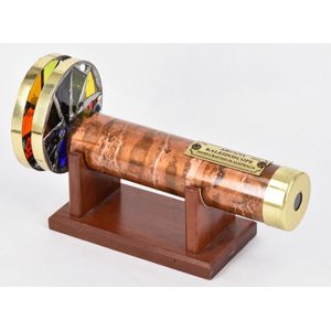 A kaleidoscope, round brass tube, with two rotating circular…
