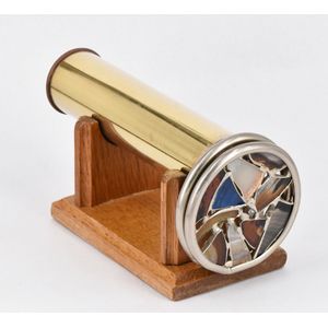 A kaleidoscope, round brass tube, with two rotating circular…