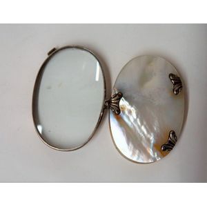 A 19th century European mother-of-pearl and silver magnifying…