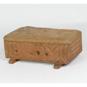 A Jane Brenkley carved box, the exterior carved with Maori…