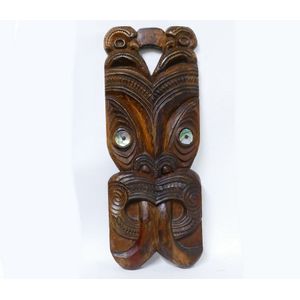 A large Maori carved wheku mask, with paua ring eyes, open…