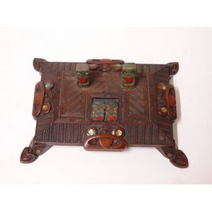 An early 20th century Maori carved desk stand, all over lineal…