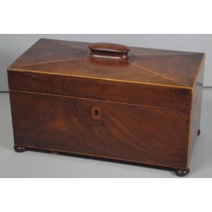Georgian mahogany sarcophagus tea caddy, on four bun feet, with…