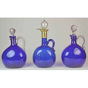 Three Victorian Bristol blue glass decanters, mid 19th century.…