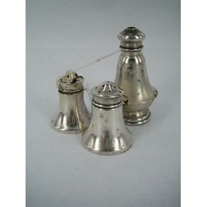 Two Australian silver pepper shakers and a salt shaker; Prouds…