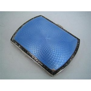 An enamel and silver cigarette case, translucent pale blue…