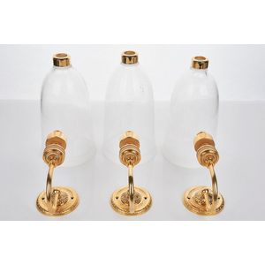 Versace, trio of wall sconces, gilded metal and glass,…