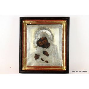 An antique Russian silver oklad painted icon, 19th century, the…