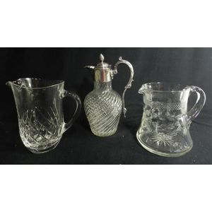 Two crystal jugs & a silver plate & crystal wine jug, height…