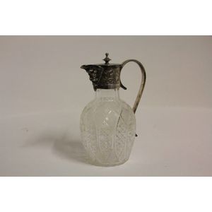 A fine English cut crystal claret jug with engraved plated…