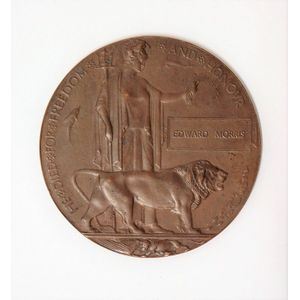 A World War I bronze memorial plaque, Dead Man's Penny', named…