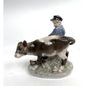 A Royal Copenhagen, Denmark porcelain figure of a boy & a cow,&hellip;