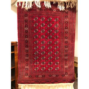Persian Bokhara Rug, traditional design in rich red tones, wool…