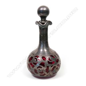 A late Victorian silver over ruby glass scent bottle, the&hellip;