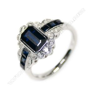 A 14ct white gold sapphire and diamond filigree ring, a bezel…