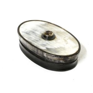 A Victorian oval horn snuff box, the lid set with a facet cut…
