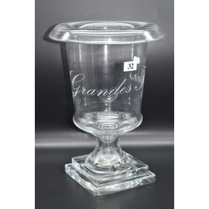 A footed glass wine cooler
